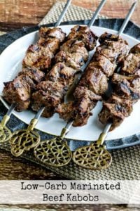 Beef kabobs on a white plate