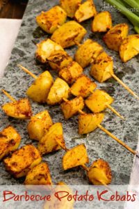 Barbecue potato kebabs on stone tray