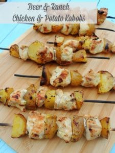 Beer and ranch chicken and potato kabobs on cutting board