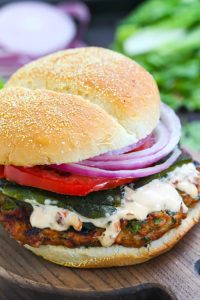 Chicken fajita burger on cutting board