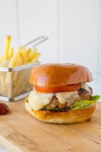Chipotle Chicken Burger and fries on a cutting board