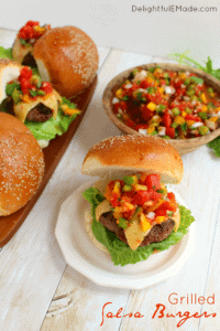 Grilled salsa burgers on white table