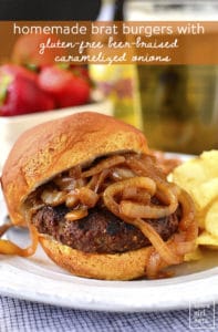 Homemade brat burger with caramelized onions and chips on a plate