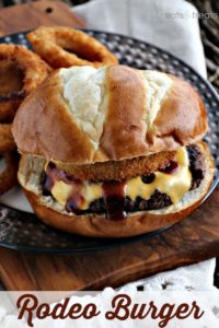 Rodeo Burger and onion rings on plate