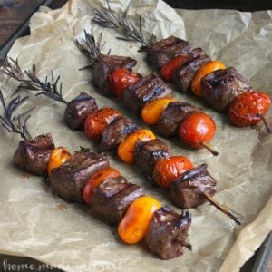 Balsamic glazed rosemary steak kebabs on parchment paper