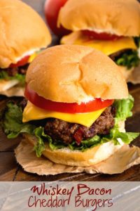 Whiskey Bacon Cheddar Burgers on table