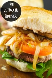 Burger with caramelized onions, tomato, and lettuce