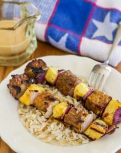 Tempeh pineapple kebabs and rice on plate