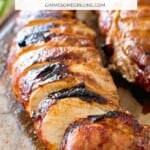 Grilled Asian pork loin slices on cutting board