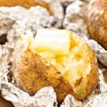 baked ptoatoes cut up with butter