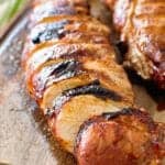 grilled pork loin slices on cutting board