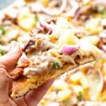 Pulled Pork Pizza Slice in hand