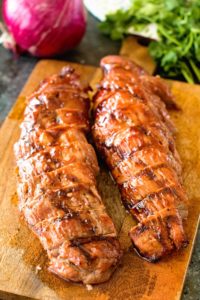 Pork loin slices on cutting board