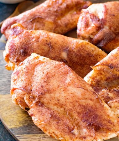 Smoked chicken breasts on cutting board
