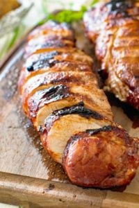 Grilled Asian Pork Loin pieces on cutting board