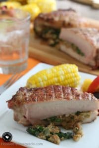 Grilled stuffed pork chop and corn on the cob