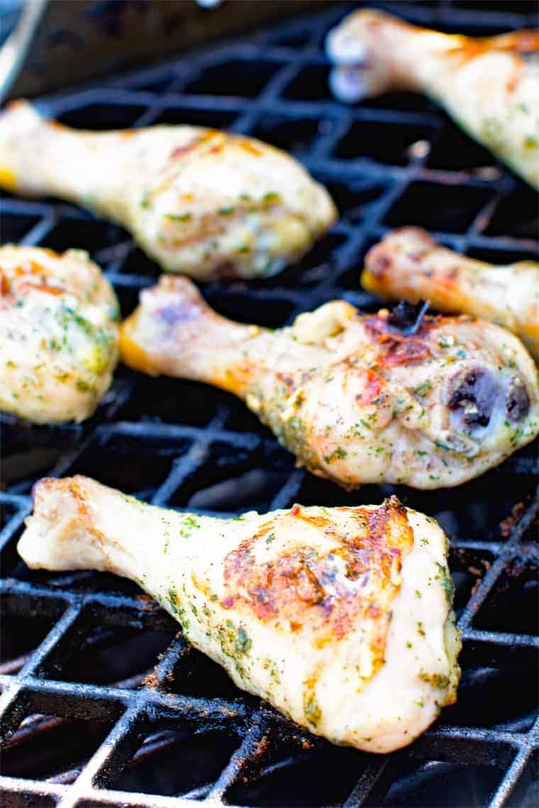 Chicken legs with ranch seasoning on a grill grate 