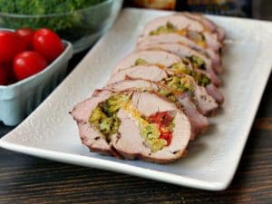 Grilled stuffed pork loin slices on plate