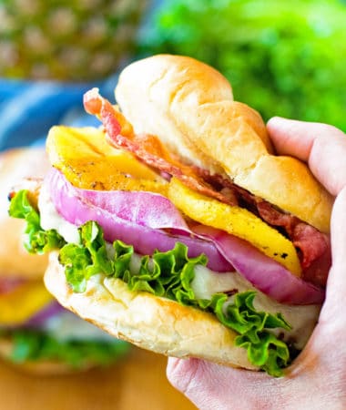 Grilled Pineapple Teriyaki Chicken Burger in hand