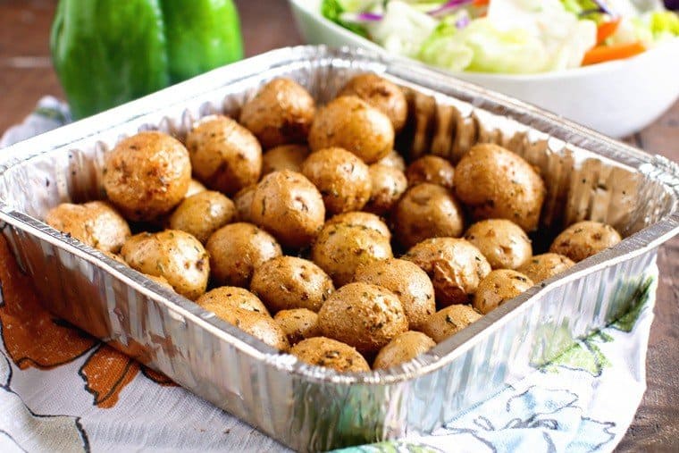 Smoked potatoes in foil pan