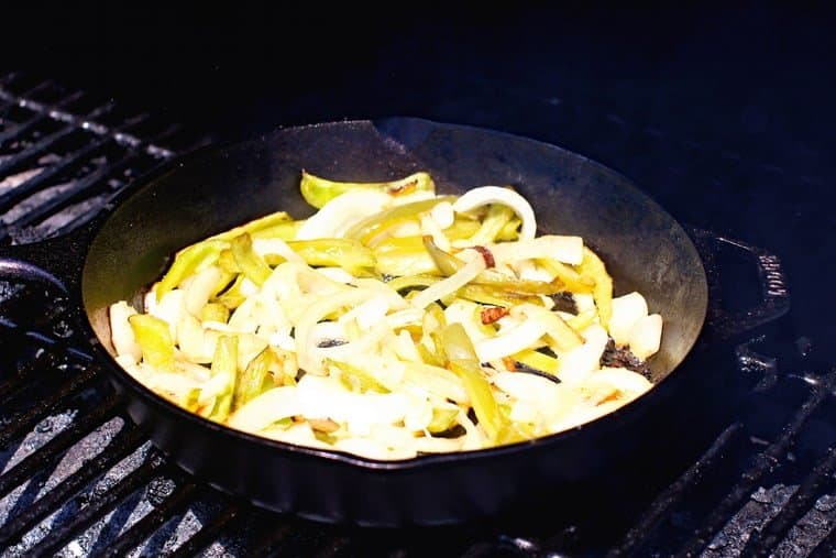Oinon and Green Peppers in Cast Iron Skillet
