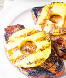 Grilled pineapple pork chops on a plate