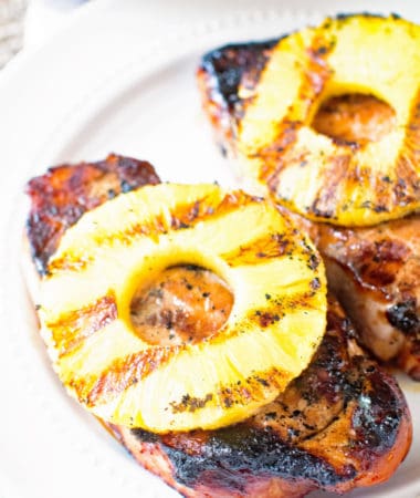 Grilled pineapple pork chop on a plate