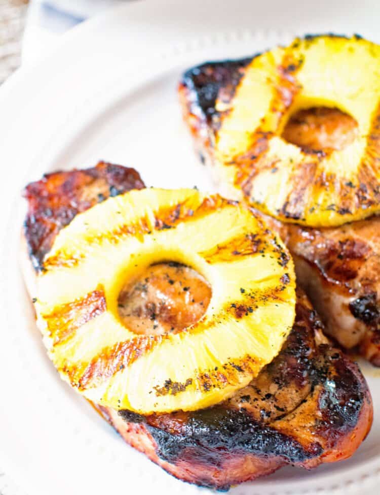 Grilled pineapple pork chops on a plate