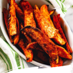 Grilled sweet potato wedges in white bowl