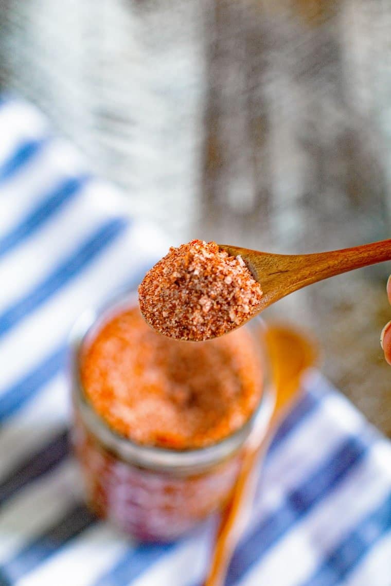 Rub on a small wooden spoon with a mason jar of rub in background