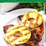 Pineapple grilled pork chops on white plate