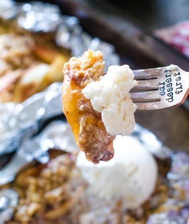 A bite of campfire apple crisp on fork