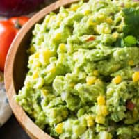 Corn guacamole in brown bowl