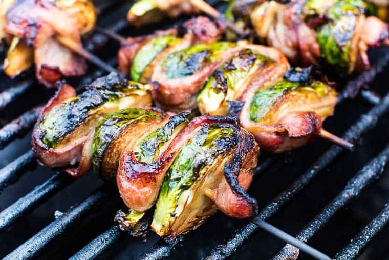 Grilled Brussels Sprouts on skewer laying on grill