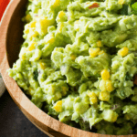 Grilled Corn Guacamole in wood bowl