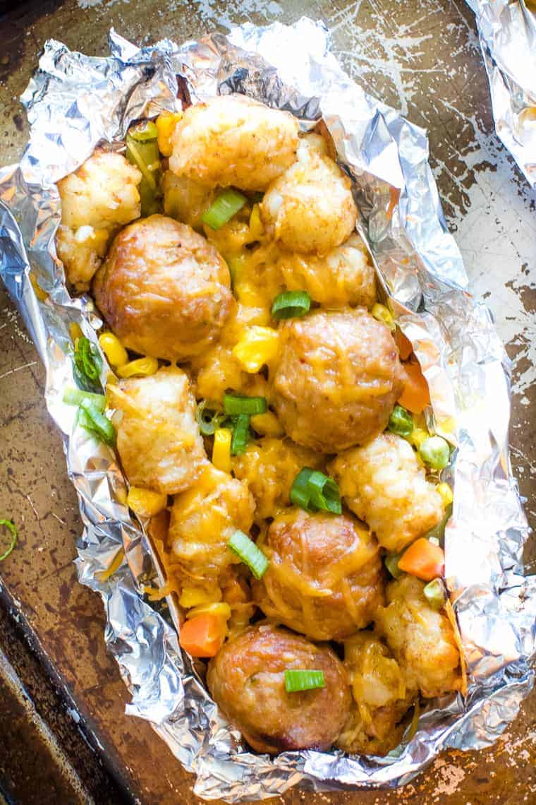 Tater Tot Meatball Foil Packets with Vegetables on sheet pan