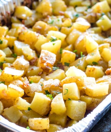 Cheesy Potatoes on the Grill with bacon in a foil pan