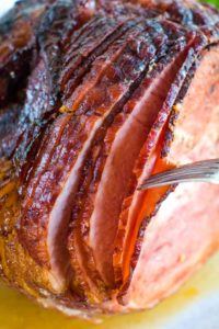 Smoked Spiral Ham Pieces being pulled apart by a fork