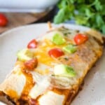 Plate with pulled pork enchiladas
