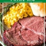 Prime Rib slice on plate with corn and roll