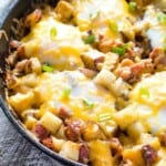 Breakfast skillet full of potaote, cheese, and eggs