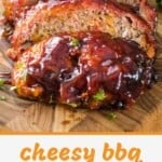 Cheesy BBQ Smoked Meatloaf slices on a wooden cutting board.
