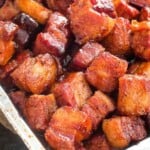 Traeger pork belly burnt ends in a metal pan