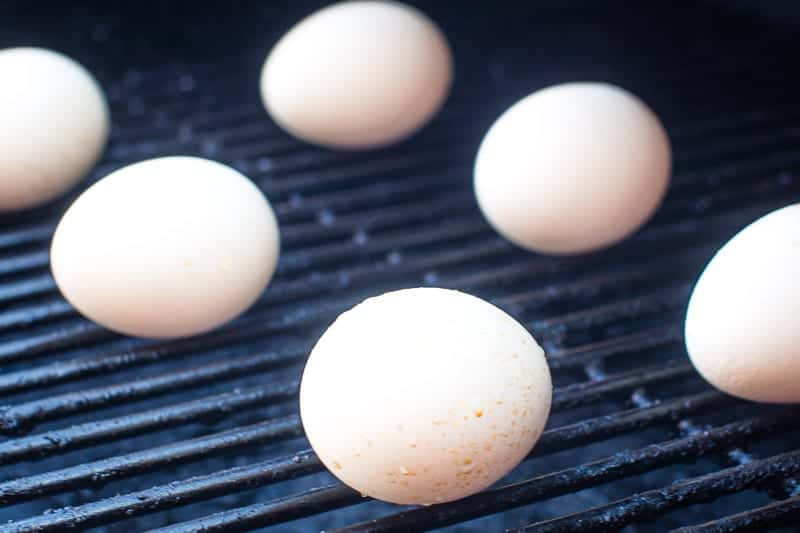 Eggs being hard boiled on pellet grill rack