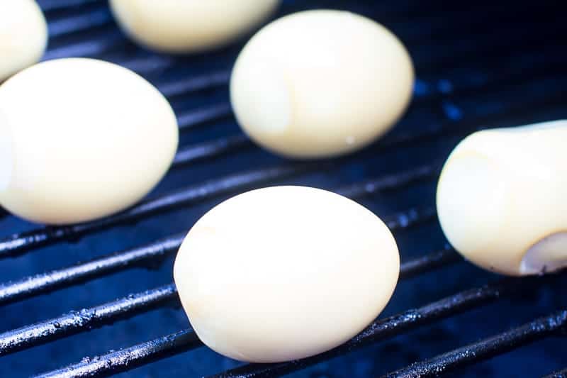 Eggs on smoker rack being cooked