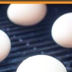 smoked eggs pinterest image. four cooked eggs on a grill.