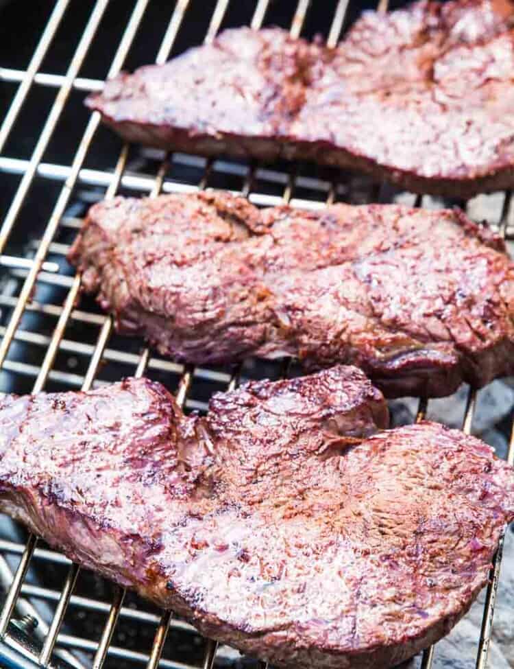Steaks on charcoal grill