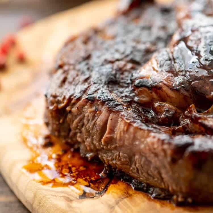 steak on brown platter marinaded