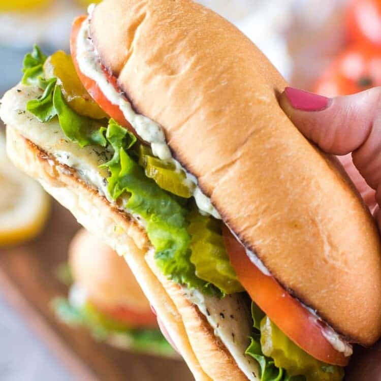Hand holding Grilled Walleye Sandwich Recipe