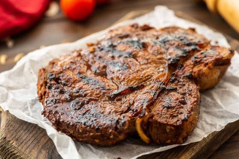 Grilled steak on cutting board